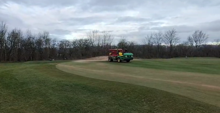 All Greens Tined, Fertilised & Topdressed